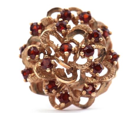 9ct gold garnet set dress ring, bombe style, comprising a series of 16 round faceted almandine garnets, individually claw set