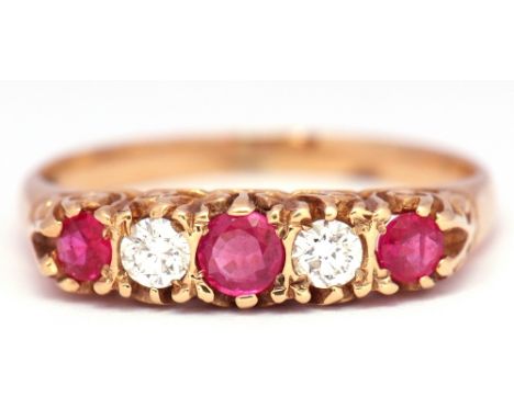 Diamond and ruby ring, alternate set with 3 round cut rubies and 2 brilliant cut diamonds, all in a carved gallery, stamped 1