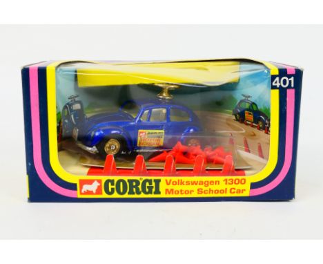 Corgi Toys - A boxed Corgi Toys #401 Volkswagen 1300 'Motor School'. The model in metallic blue with yellow interior, comes w