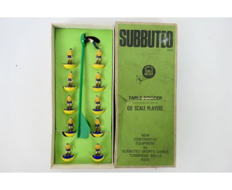 Subbuteo - A boxed Heavyweight set labeled Rumania # 160. The team in yellow shirt and blue shorts appear in Good condition w