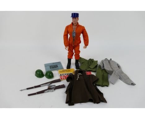 Palitoy - Action Man - An unboxed Action Pilot figure with overalls, cap, boots, star card, air manual and equipment manual. 