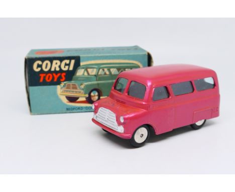 Corgi Toys - A boxed Corgi Toys #404 Bedford Dormobile Personnel Carrier. The model in Cerise with spun hubs and split windsc