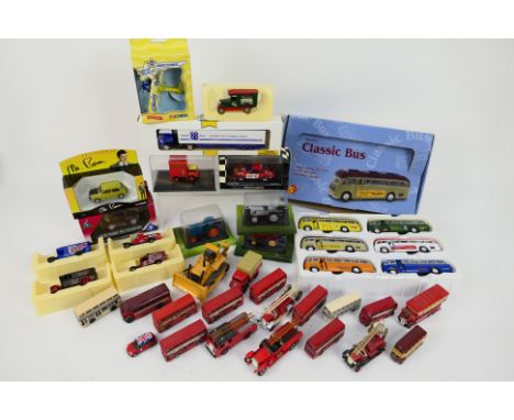 Minichamps - Corgi - Solido - Lledo - A mixed collection of boxed and unboxed diecast model vehicles in several scales. Lot i