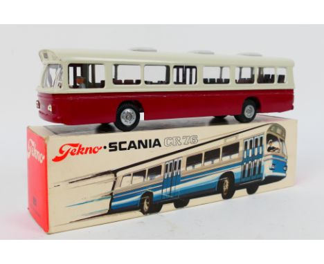 Tekno - A boxed Tekno #851 Scania CR76 diecast model bus. The model in cream and maroon,brown interior and cast hubs, has a l