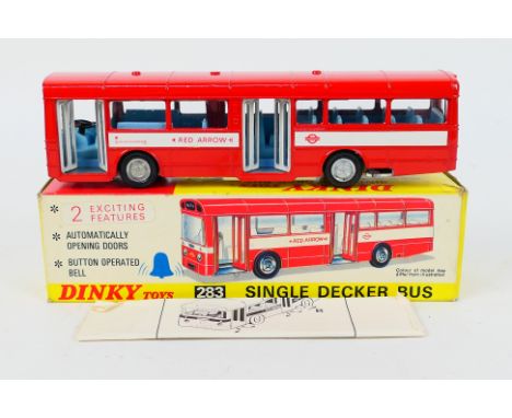 Dinky Toys - A boxed Dinky Toys #283 Single Decker Bus. The model in London Transport Red Arrow livery appears to be in Mint 