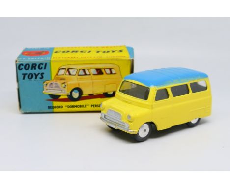 Corgi Toys - A boxed Corgi Toys #404 Bedford Dormobile Personnel Carrier. The model in yellow with pale blue roof, spun hubs 