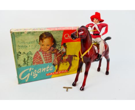 Quercetti - A boxed Gigante Galoppa clockwork galloping horse and rider with key. The model appears in Good condition with so