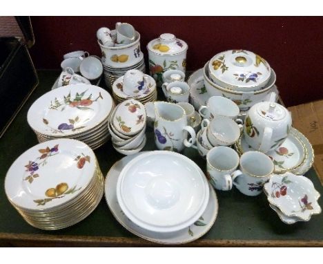 Royal Worcester Evesham dinnerware comprising plates, coffee and tea cups, saucers, biscuit barrel, salt and pepper pots, tur