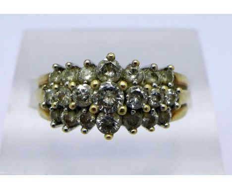 A 9ct gold ring, approximately 1ct diamond weight, weight 3.9g, size P