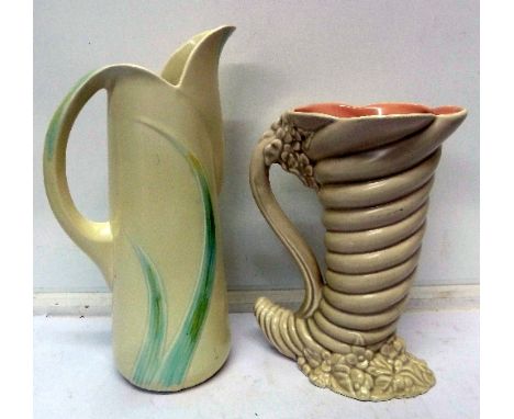 A Clarice Cliff shell-shaped vase, height 22cm, and a Carlton ware jug, jug a/f