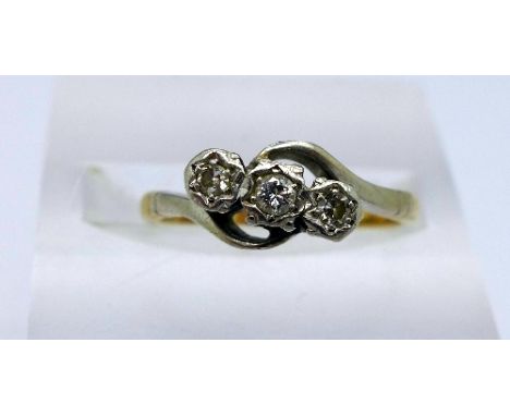 An 18ct gold, platinum set three stone diamond ring, weight 2.5g, size M