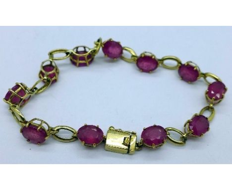 A 9ct gold and ruby bracelet, total weight 9.9g