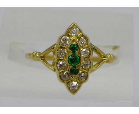 An 18ct gold, emerald and diamond marquise cluster ring, Birmingham 1931, weight 2.5g, size O