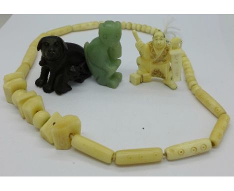 Three netsuke and a carved bead necklace