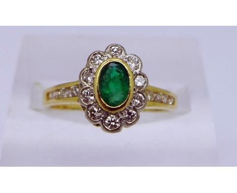 An 18ct gold, diamond and emerald cluster ring, 0.35ct emerald, total weight 3.5g, size L