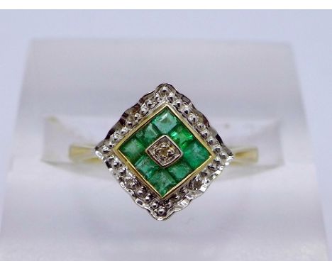 A 9ct gold, diamond and emerald ring, weight 1.7g, size L