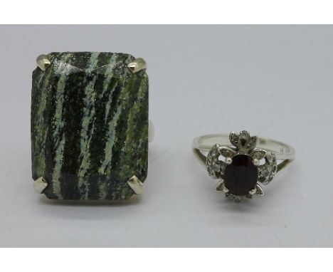 A silver and garnet ring and a silver and green stone ring