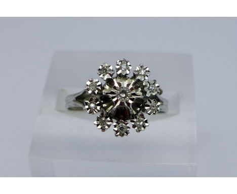 An 18ct white gold and diamond ring, weight 4g, size R