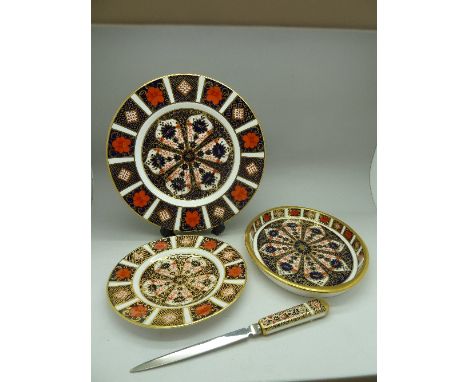 Four items of Royal Crown Derby 1128 Imari pattern china; two plates, a tray and a paper knife, seconds