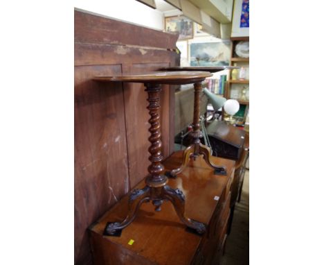 Two Victorian figured walnut circular tripod tables, largest 51cm diameter. 