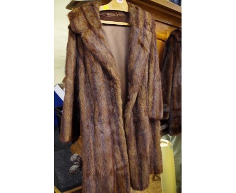A vintage brown fur three quarter length coat; together with another brown mink fur stole. 