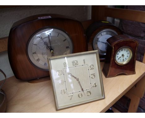 Four various timepieces,&nbsp;to include a brass easel back example. 