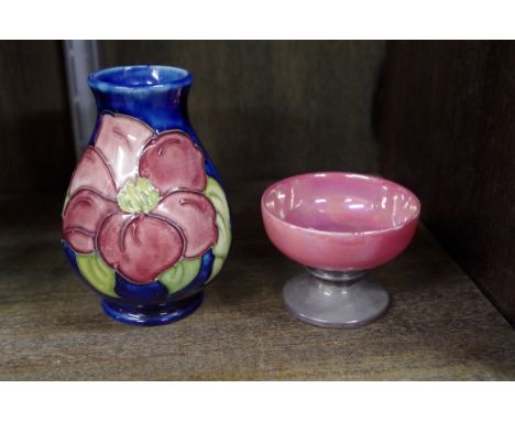 A Moorcroft vase, tubelined with a clematis, 9.5cm high; together with a silver mounted Ruskin style pottery pedestal bowl, 6