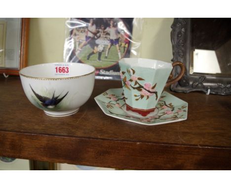 A Royal Worcester bowl, painted with a swallow by W Powell, 11.5cm diameter; together with another Royal Worcester chinoiseri