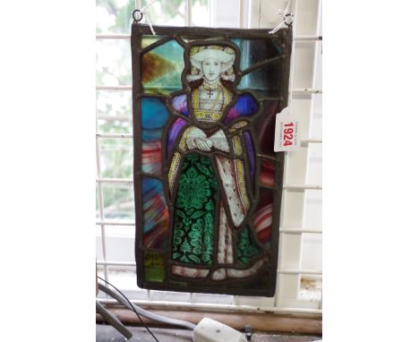 An antique stained and leaded glass panel of a lady, possibly Anne of Cleves, 29 x 15.5cm.&nbsp; 