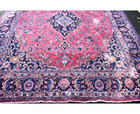 An Eastern carpet, having central floral medallion and allover floral design, 333 x 298cm. 