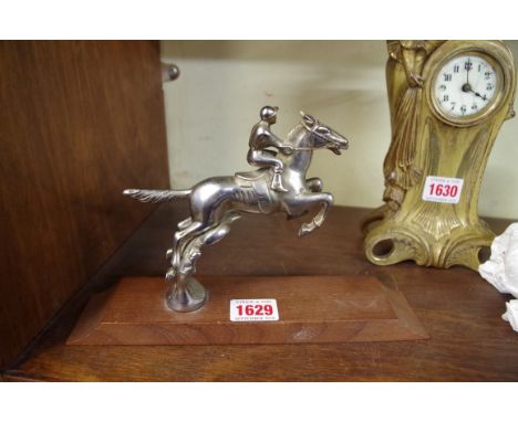 Automobilia: a vintage racehorse and jockey car mascot, by Desmo, 13cm high, on associated wood plinth.&nbsp; 