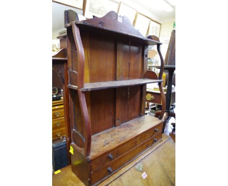 An antique mahogany hanging shelf,&nbsp;with two apron drawers, 61cm wide. 