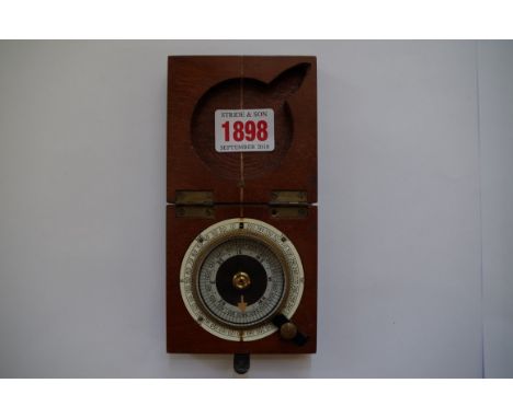 A World War I mahogany cased compass, inscribed 'F Barker &amp; Son' and dated 1819, 8cm wide.&nbsp; 