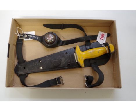 A diver's knife and plastic sheath; together with a diver's wrist compass. 