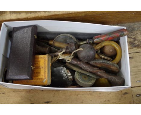 A mixed lot of works of art, to include a rosewood bilboquet; a tartan ware magnifying glass; a corkscrew; etc. 