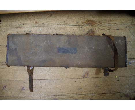 A vintage canvas shotgun case, the interior labelled 'Army and Navy Co-operative Society'. 