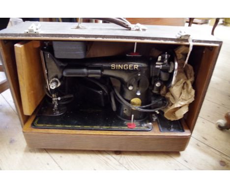 A vintage Singer 201K2 electric sewing machine,&nbsp;cased, with instruction booklet and unopened Singer oil bottle.&nbsp; 