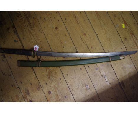 An old Japanese katana and green lacquered scabbard.  