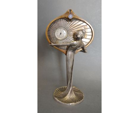 An Unusual Art Nouveau Clock of Figural Form inset with cabochon moon stone, 15 cms tall