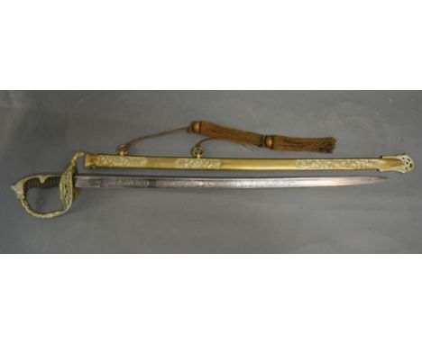 A 19th Century German Boys' Sword within a brass scabbard with pierced guard and shark skin grip and lion head pommel, the bl