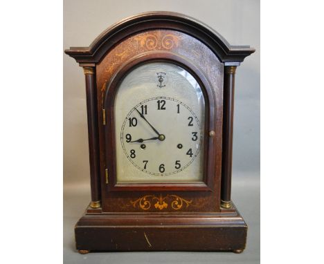 A 19th Century Mahogany Marquetry Inlaid Dome Shaped Mantle Clock, the silvered dial with Arabic numerals and strike silent a