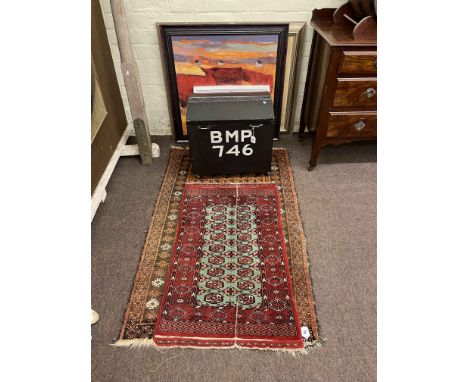 Two Eastern rugs, small dome trunk and contents and five pictures.