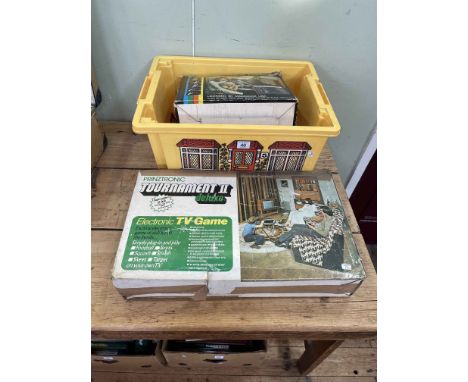 Collection of vintage game consoles and comics including Binatone, Prinztronic, etc.