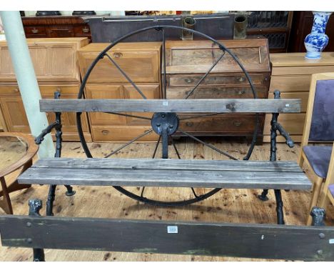 Cast naturalistic branch and wooden garden bench with nine spoke cast cartwheel back, 131cm by 183cm.