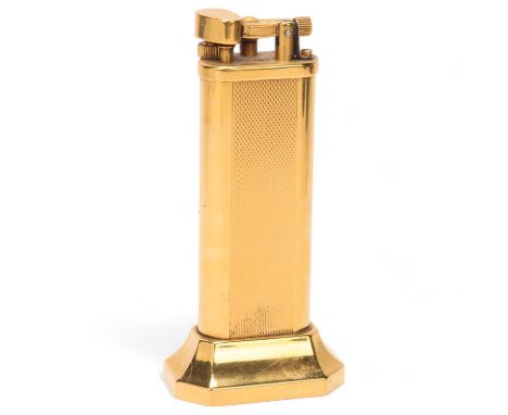 A vintage Dunhill gold plated table lighter,  makers marks to base, No 18763, height 10cmHammer loose, but appears in working