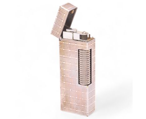 A vintage Dunhill Rollagas lighter, with silver plated textured body, makers marks to base, length 6.3Appears in working orde