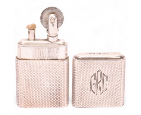 A 1946 hallmarked silver "The Howitt Lighter", engine turned body with initials GRC on cap,Untested working order, good condi