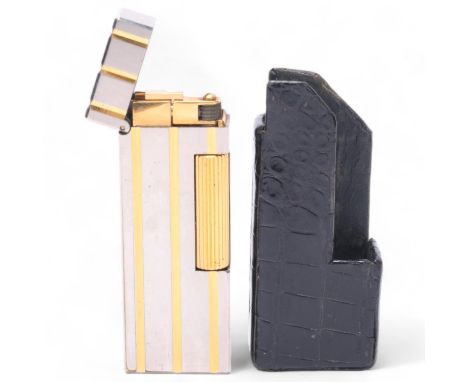 A vintage Dunhill Rollagas silver and gold plated lighter, in Dunhill leather slip-case, makers marks to baseGood condition, 