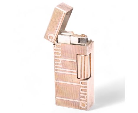 A vintage Dunhill silver plated Rollagas lighter, with Dunhill detail to body, makers marks to base No 59507, and Dunhill lea