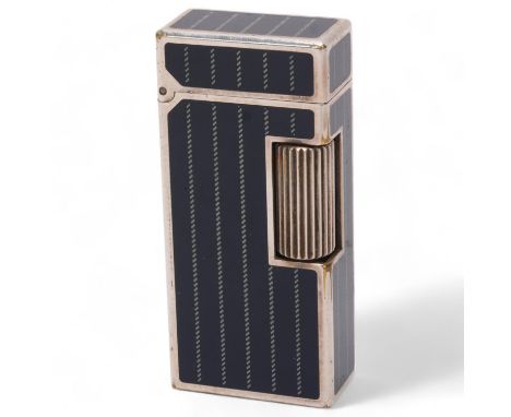A vintage Dunhill Rollagas lighter, silver plated with detailed black lacquer panels, makers marks to base, No 62626, length 